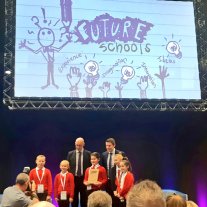 five children from St John Vianney's primary pose with their trophy alongside Depute First Minister John Swinney, and Richard Park from HUB South East